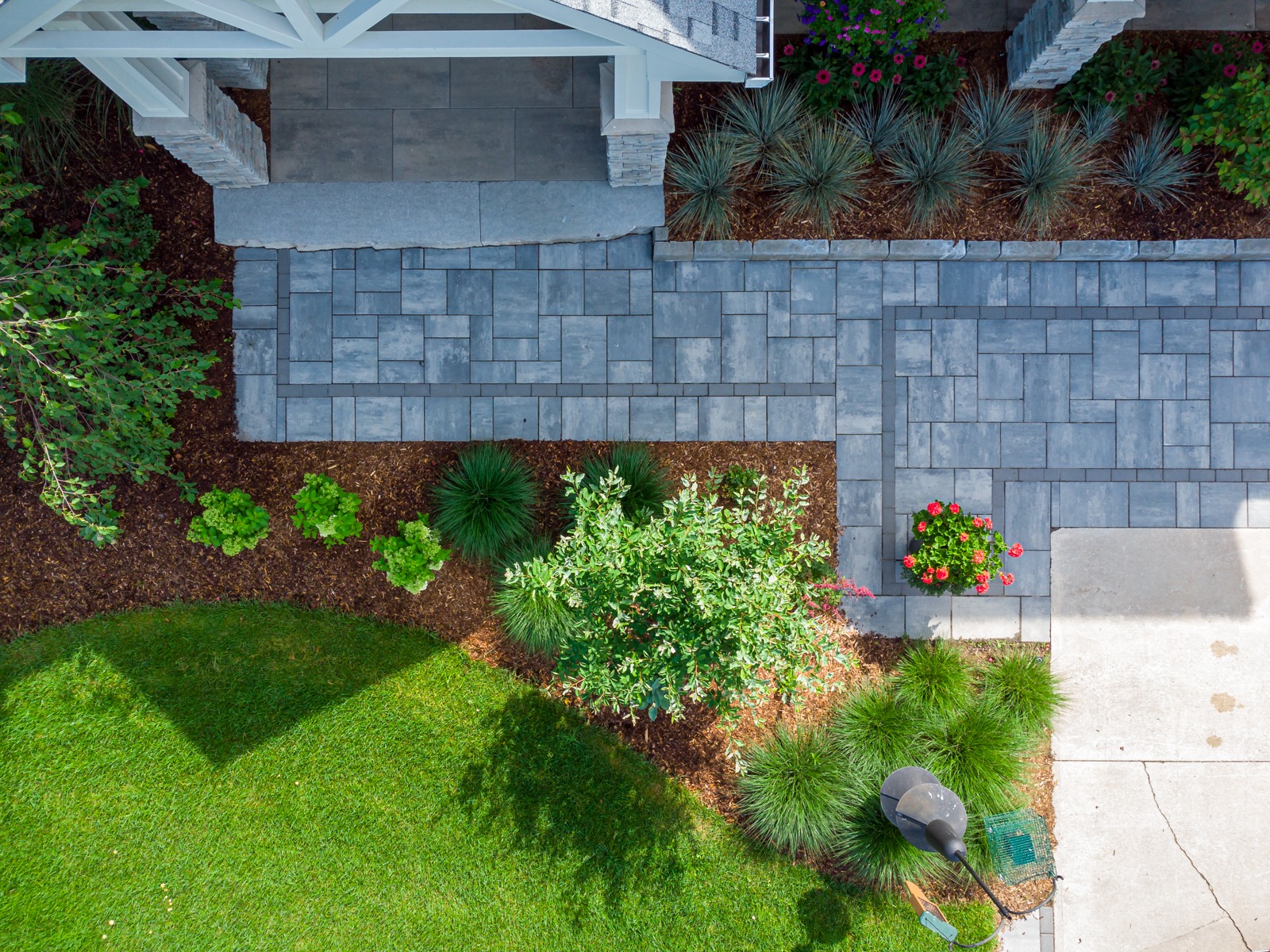Overhead view of landscaped yard with paver walkway