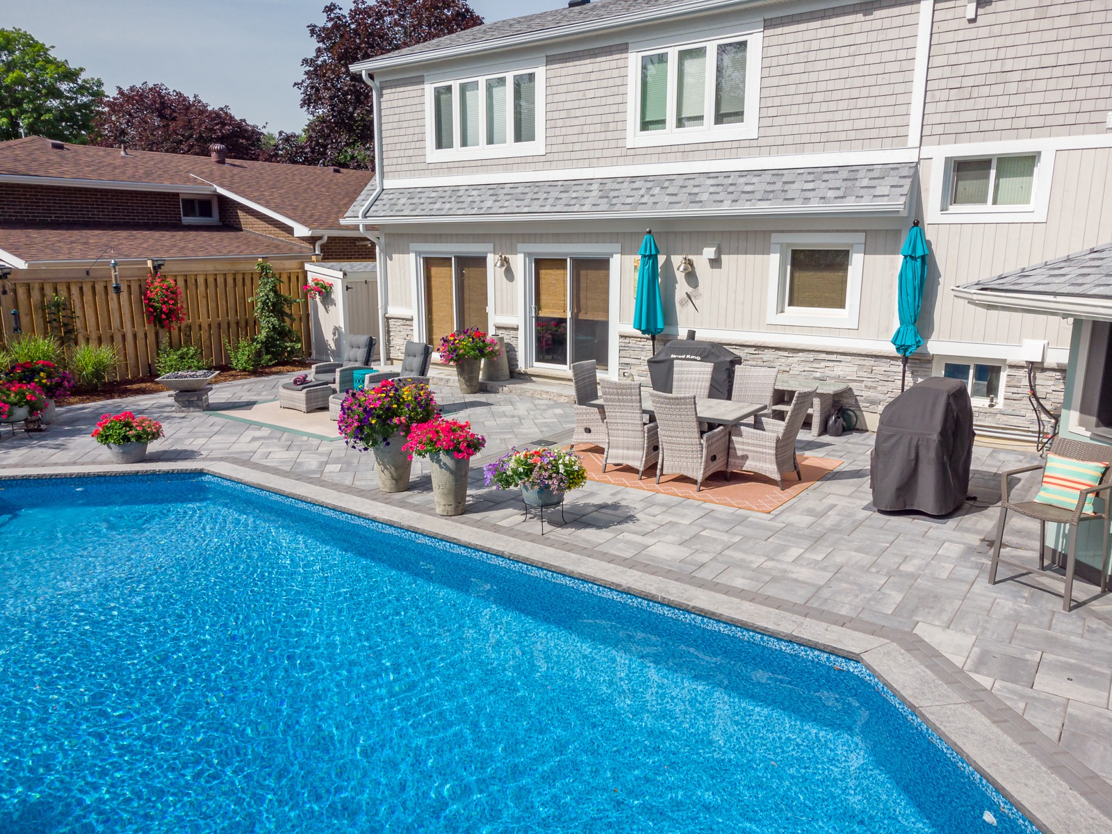 Backyard patio with pool and outdoor dining