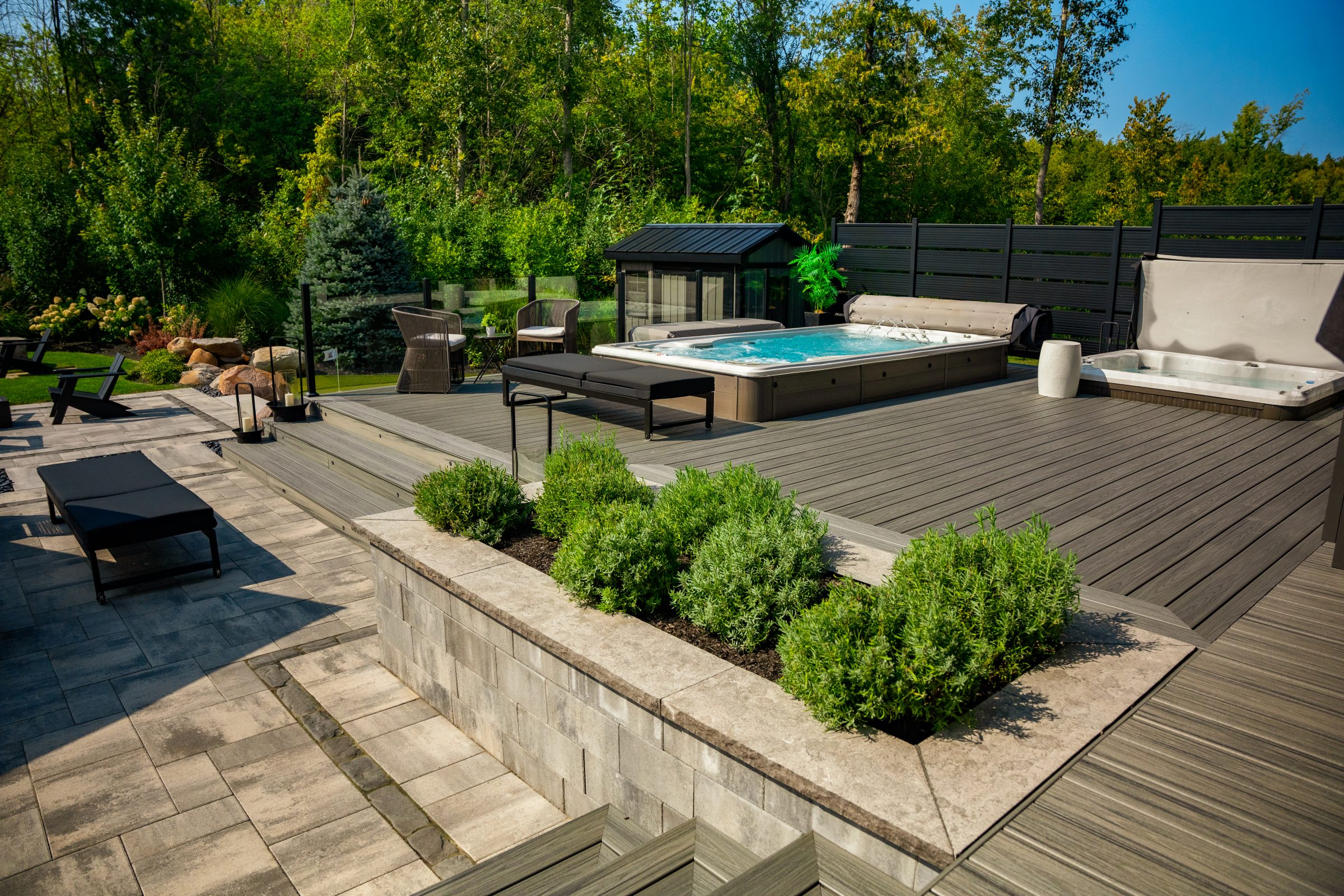 Modern backyard deck with hot tub and seating