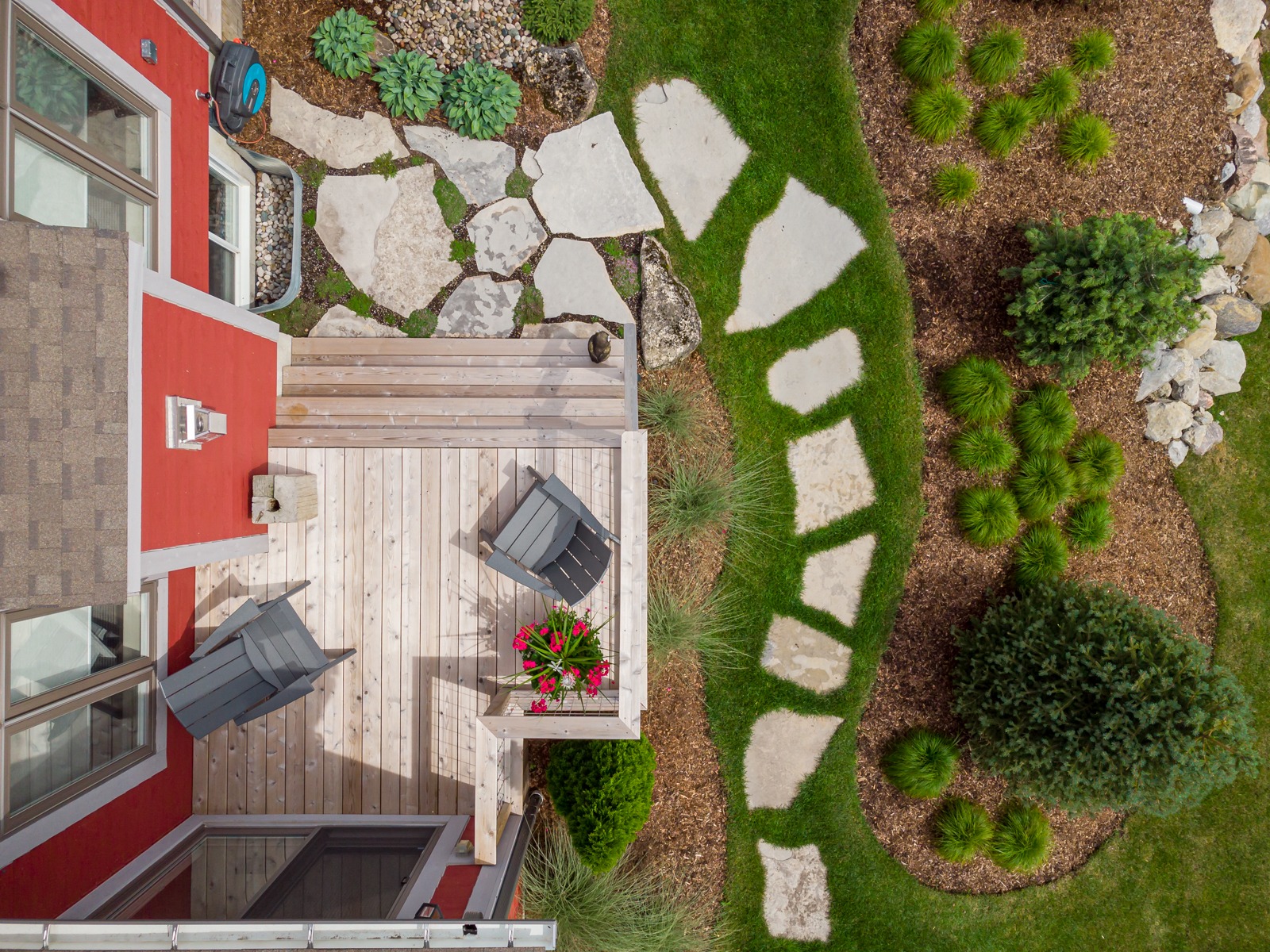 Aerial view of backyard deck and garden pathway