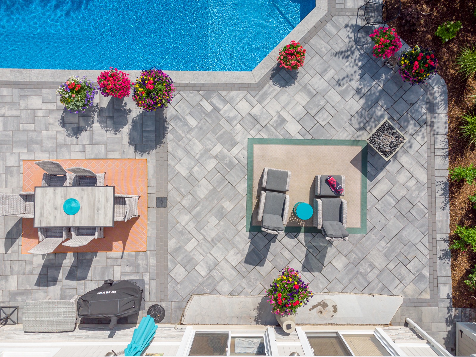 Aerial view of backyard patio with pool and seating