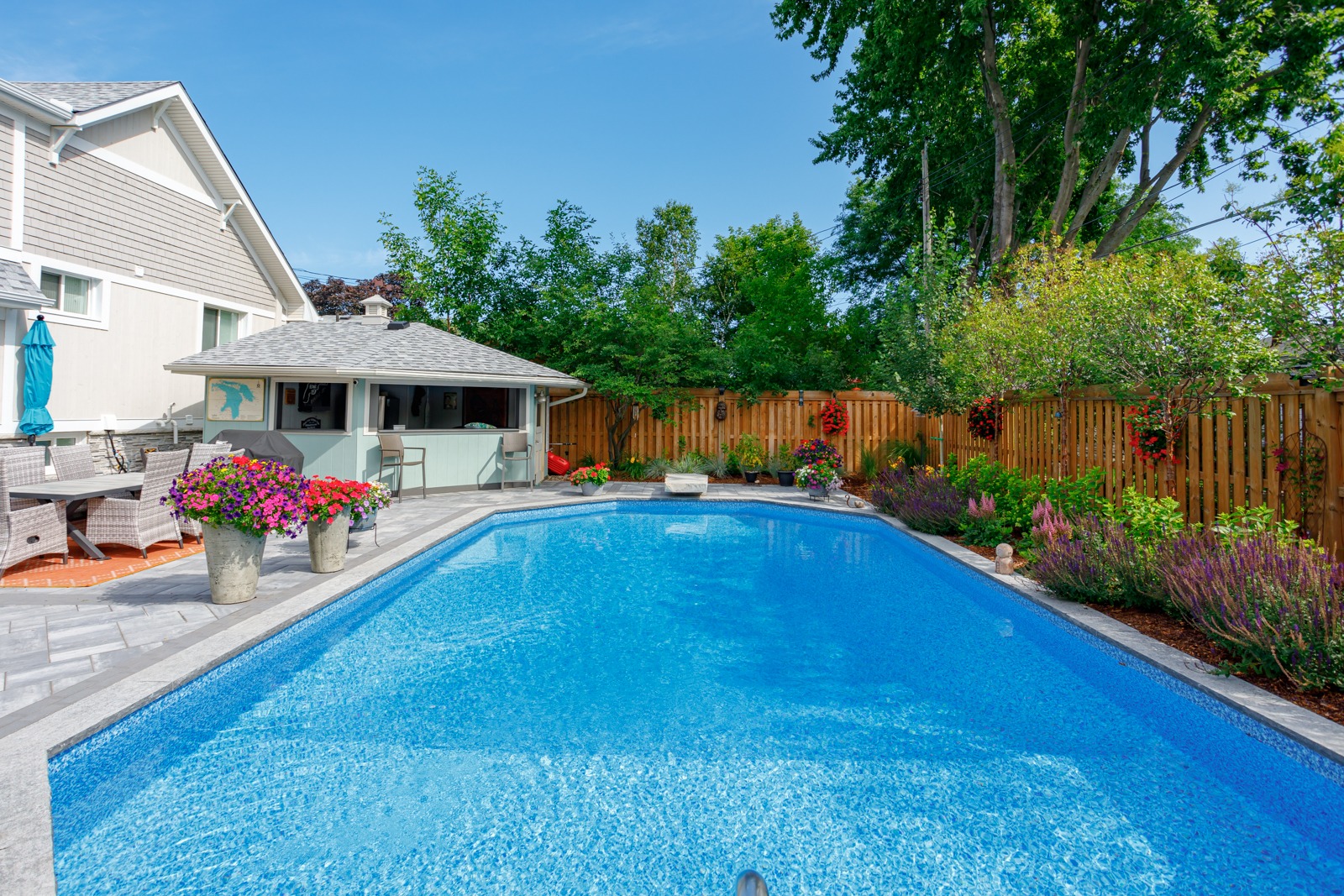 Backyard swimming pool with patio and gazebo