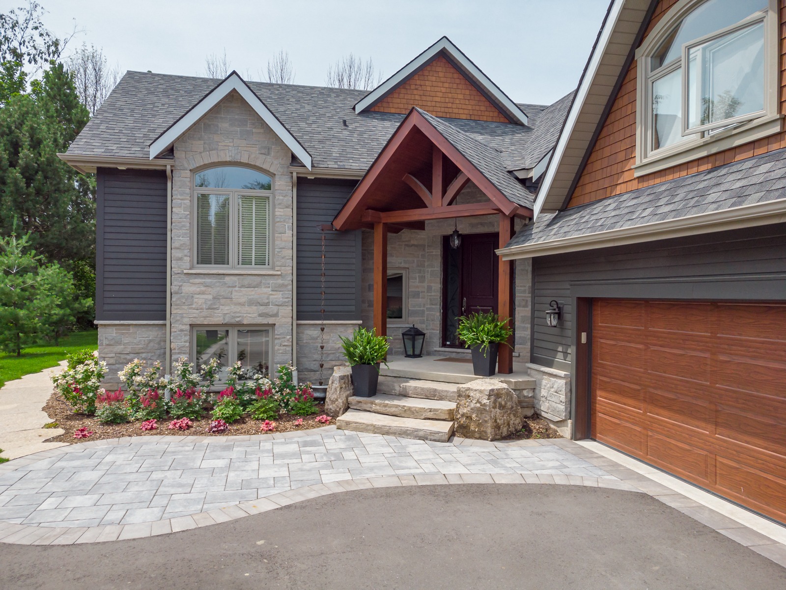 Modern stone and wood suburban home exterior