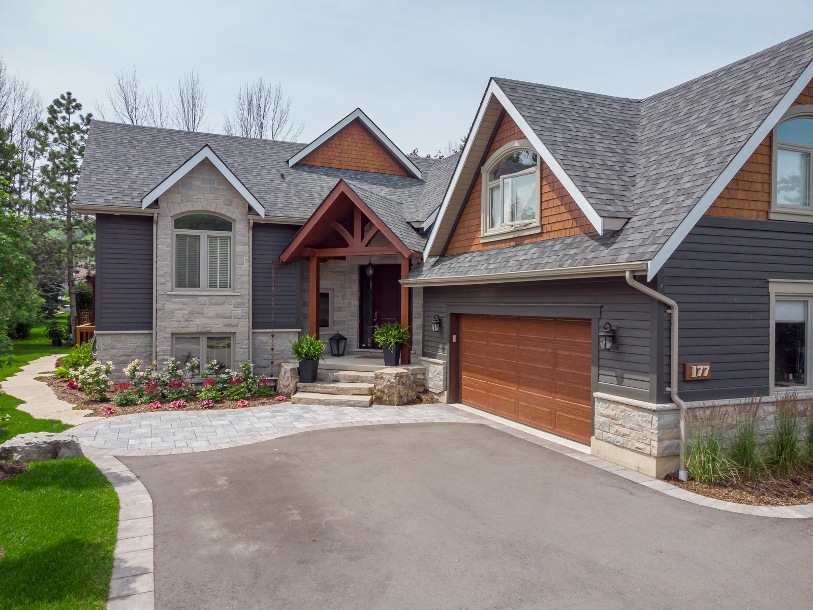 Modern suburban home with stone facade and garage