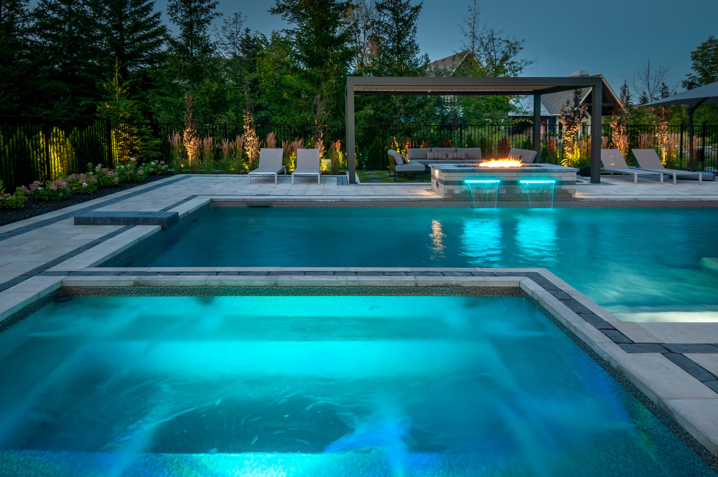 Luxury backyard pool with spa and fire feature