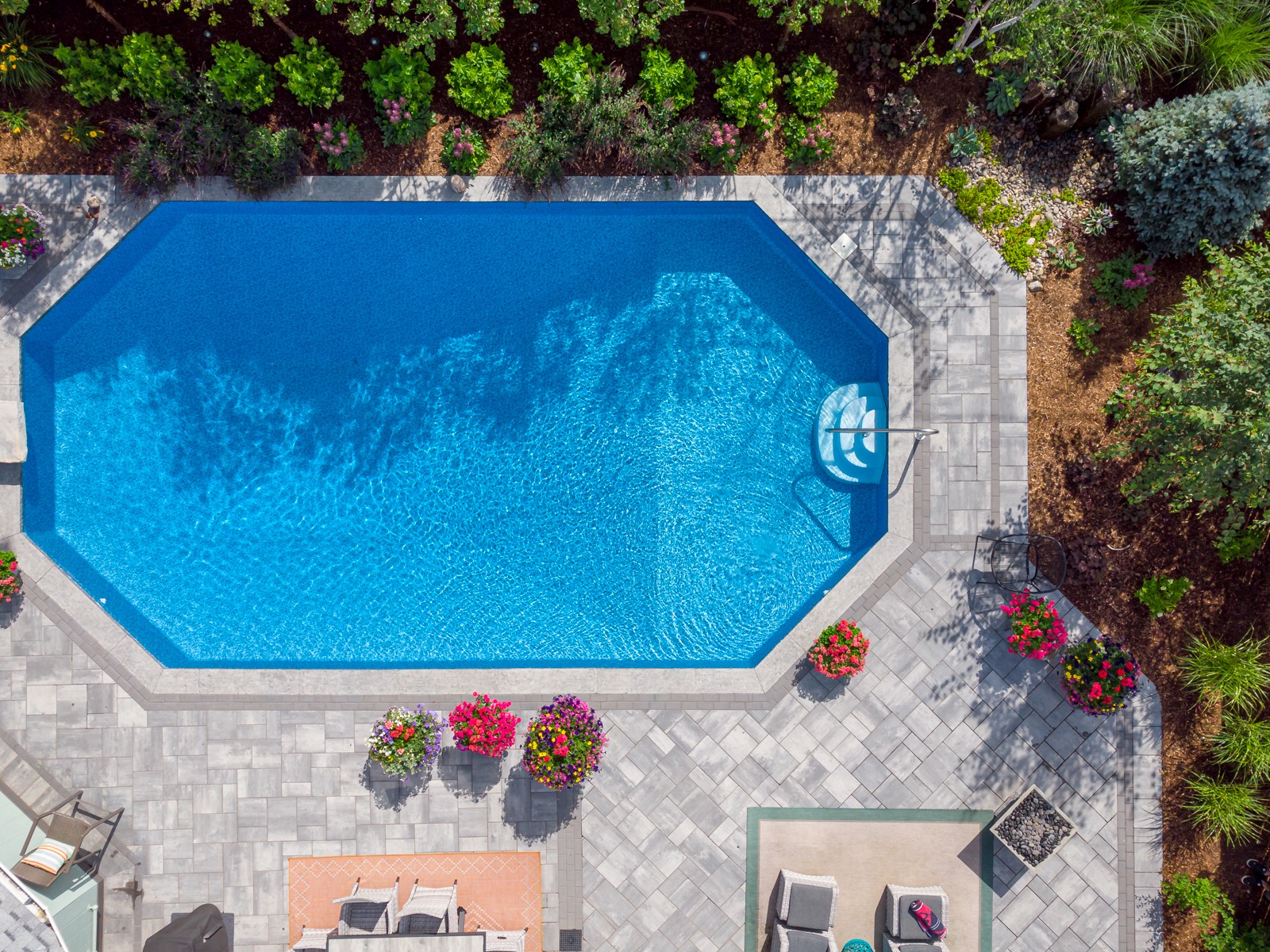 Aerial view of backyard swimming pool and patio