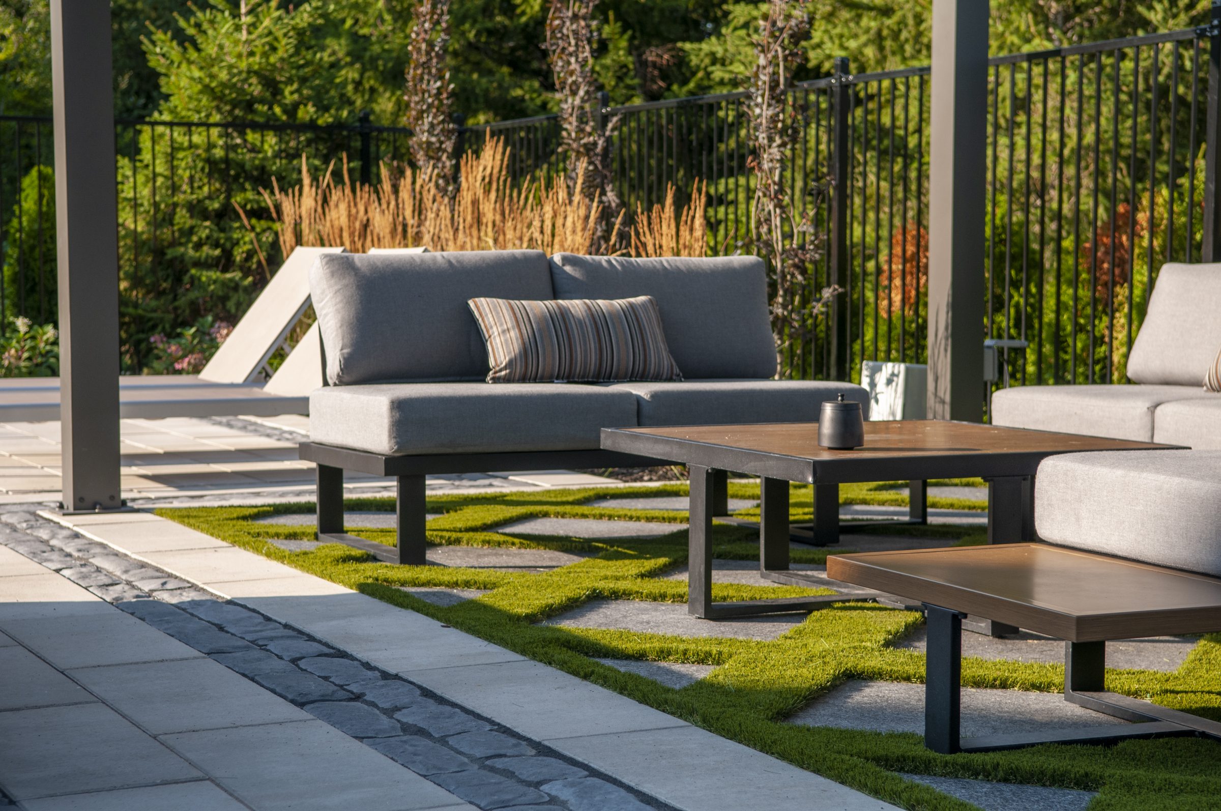 Modern outdoor patio with gray cushioned seating