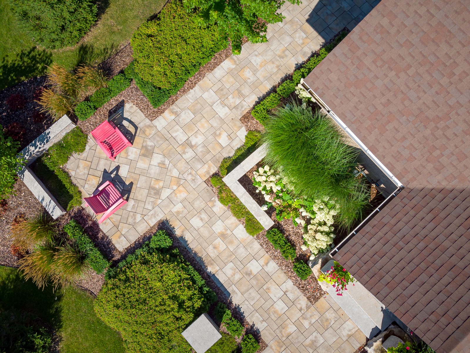 Aerial view of landscaped patio with pink chairs