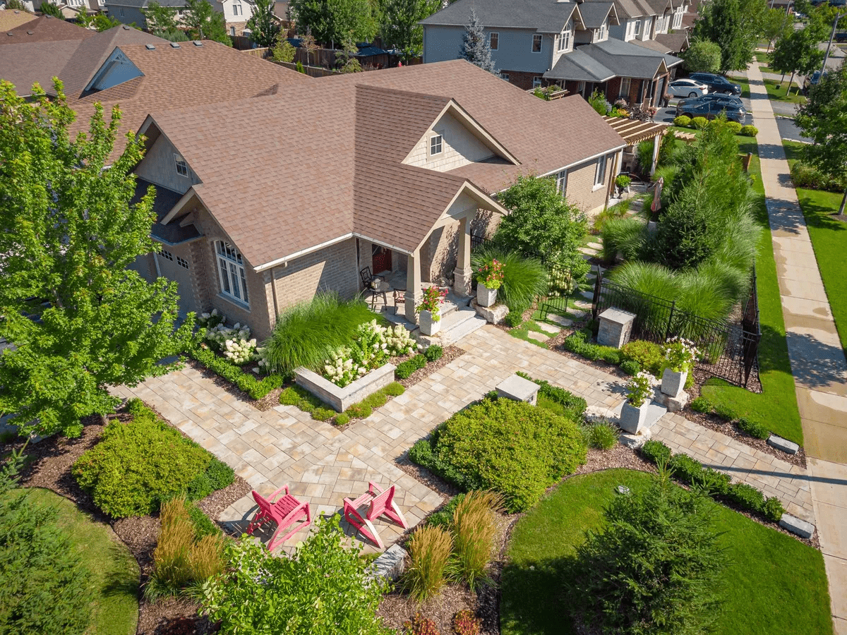 Aerial view of landscaped suburban home and patio