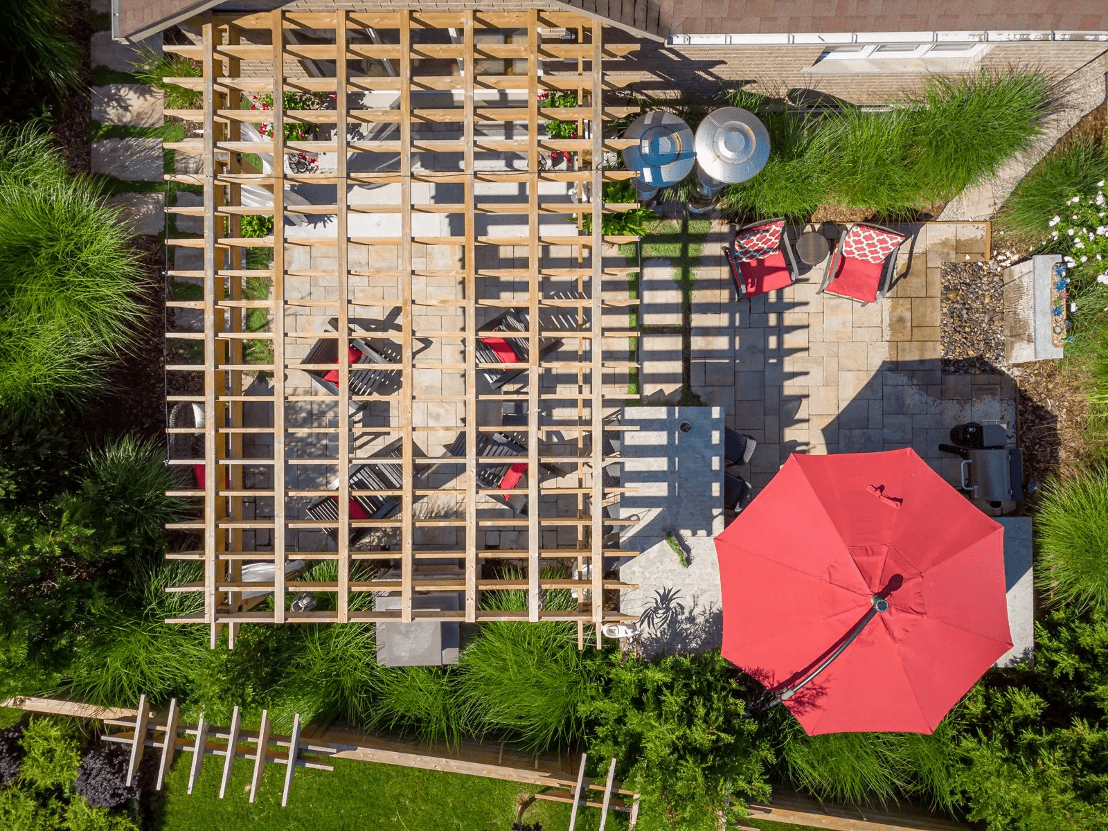 Aerial view of backyard patio with pergola