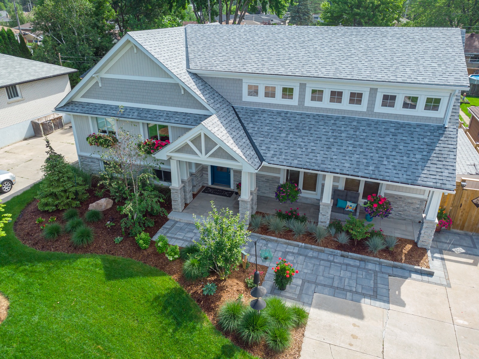 Craftsman-style home with landscaped front yard