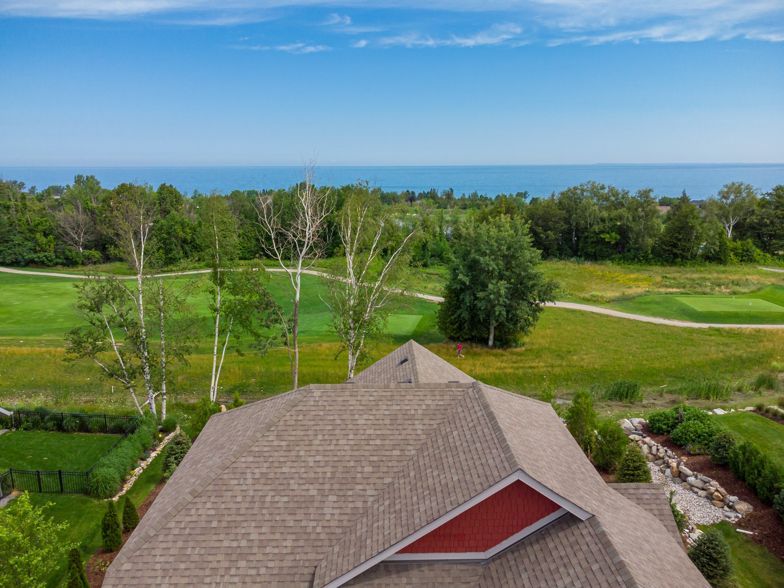 Rooftop view overlooking golf course and lake