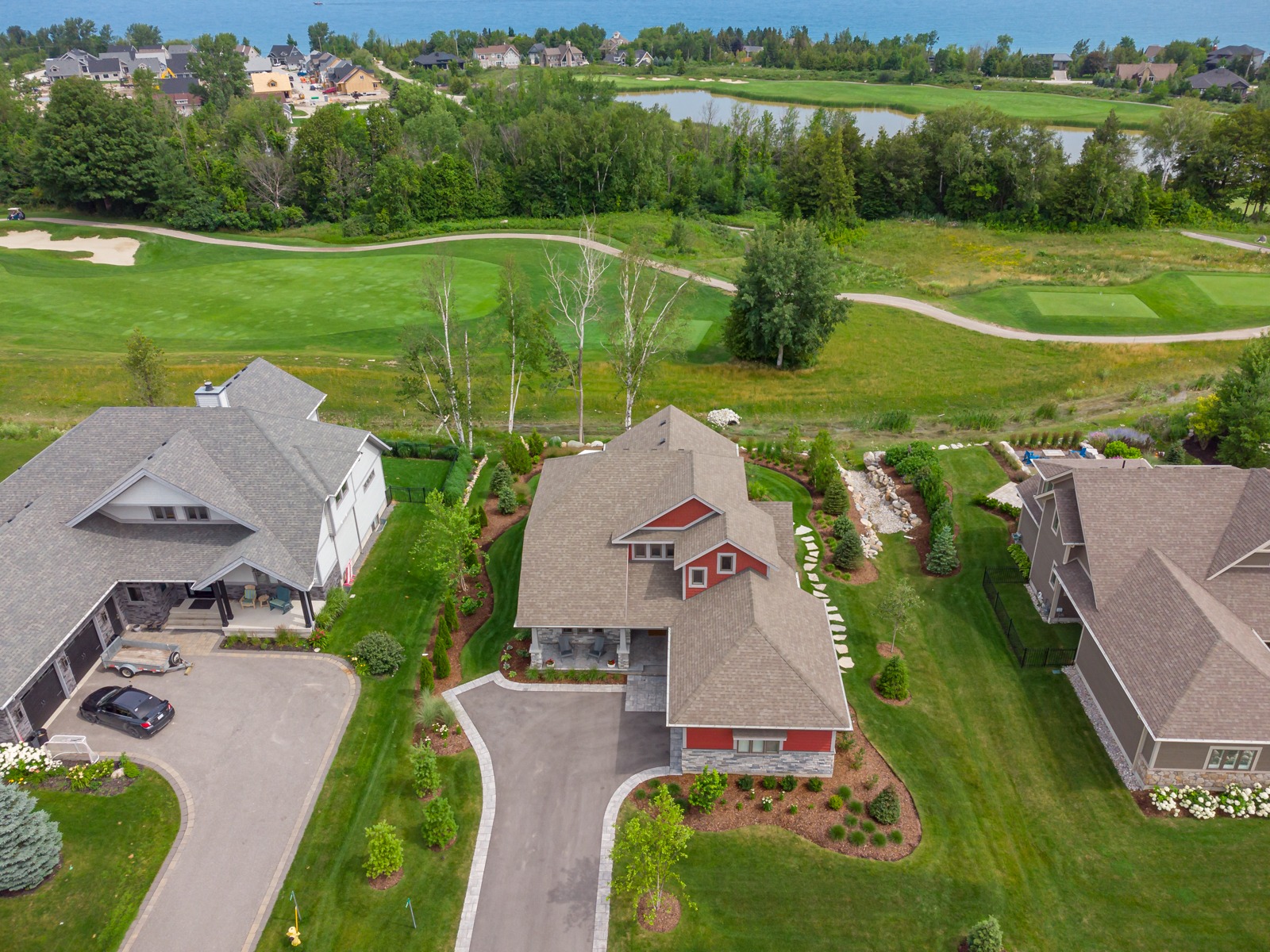 Aerial view of suburban homes by golf course