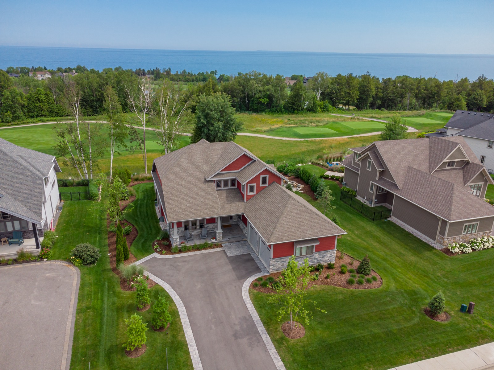 Aerial view of suburban home near golf course