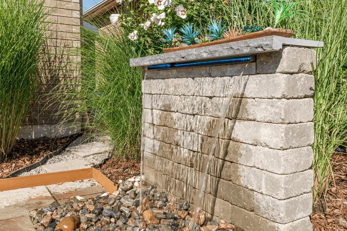 Modern stone garden fountain with cascading water