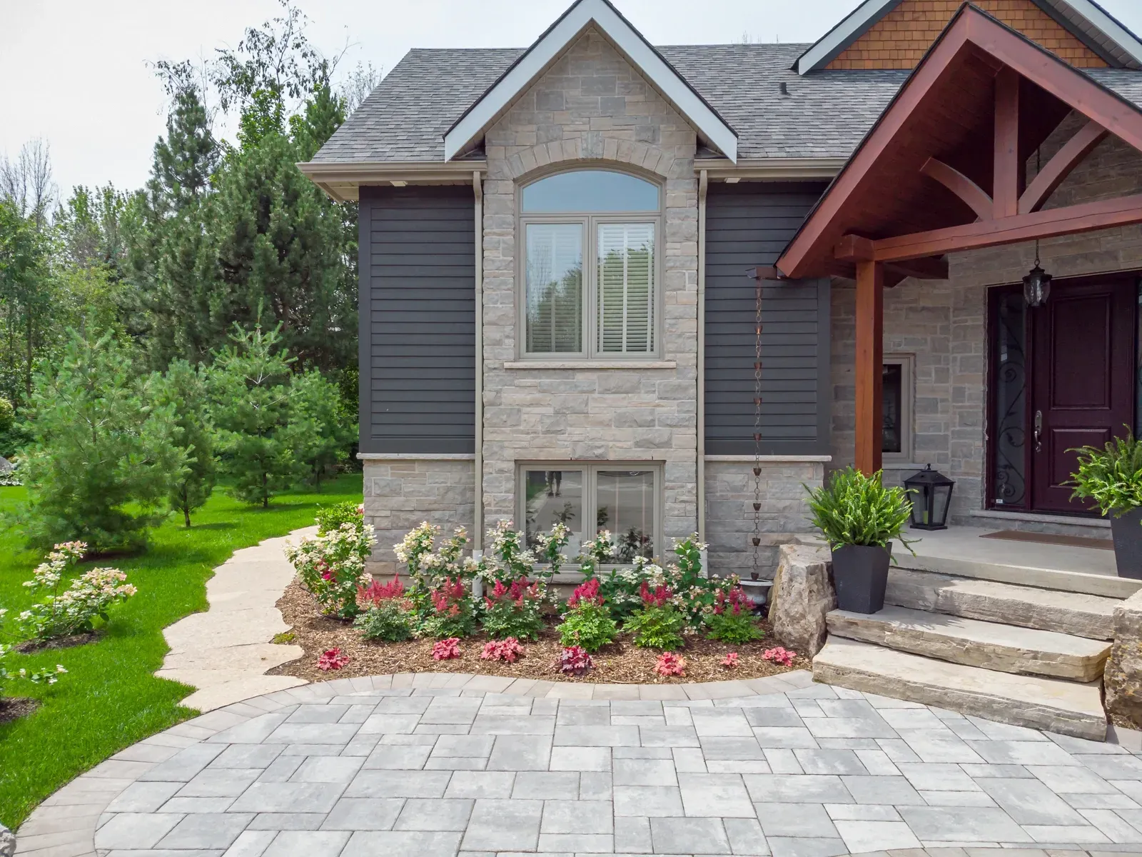 Modern stone house with landscaped front yard