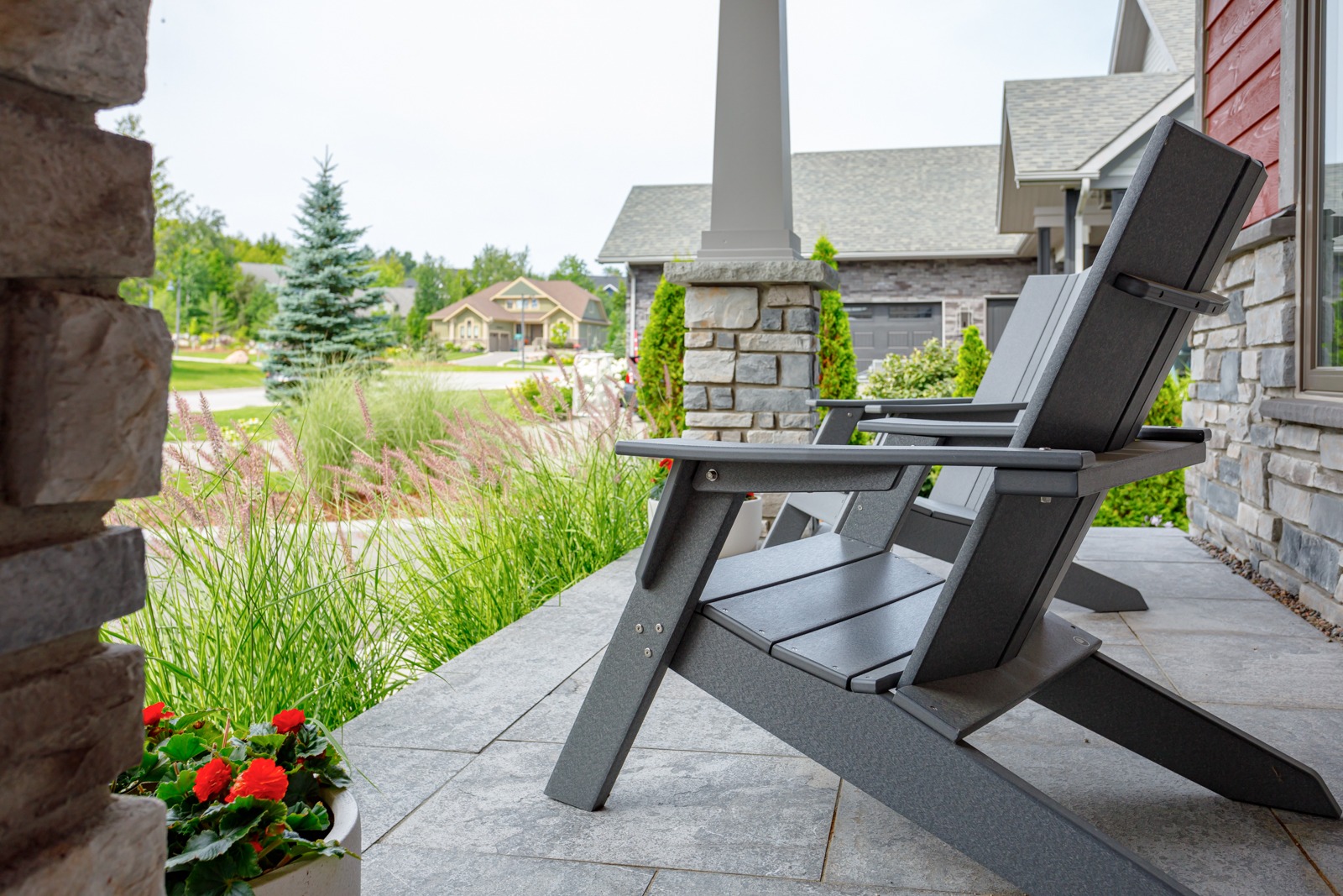 Gray Adirondack chair on modern front porch