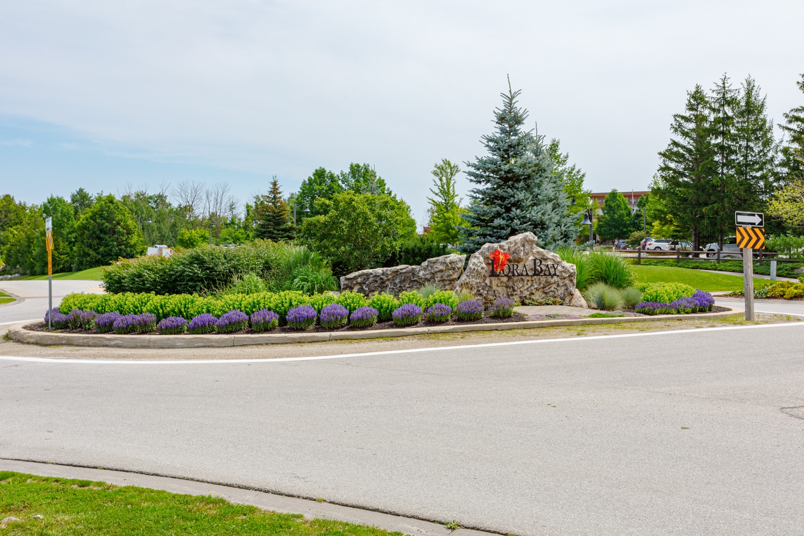 Kora Bay entrance sign with landscaped roundabout