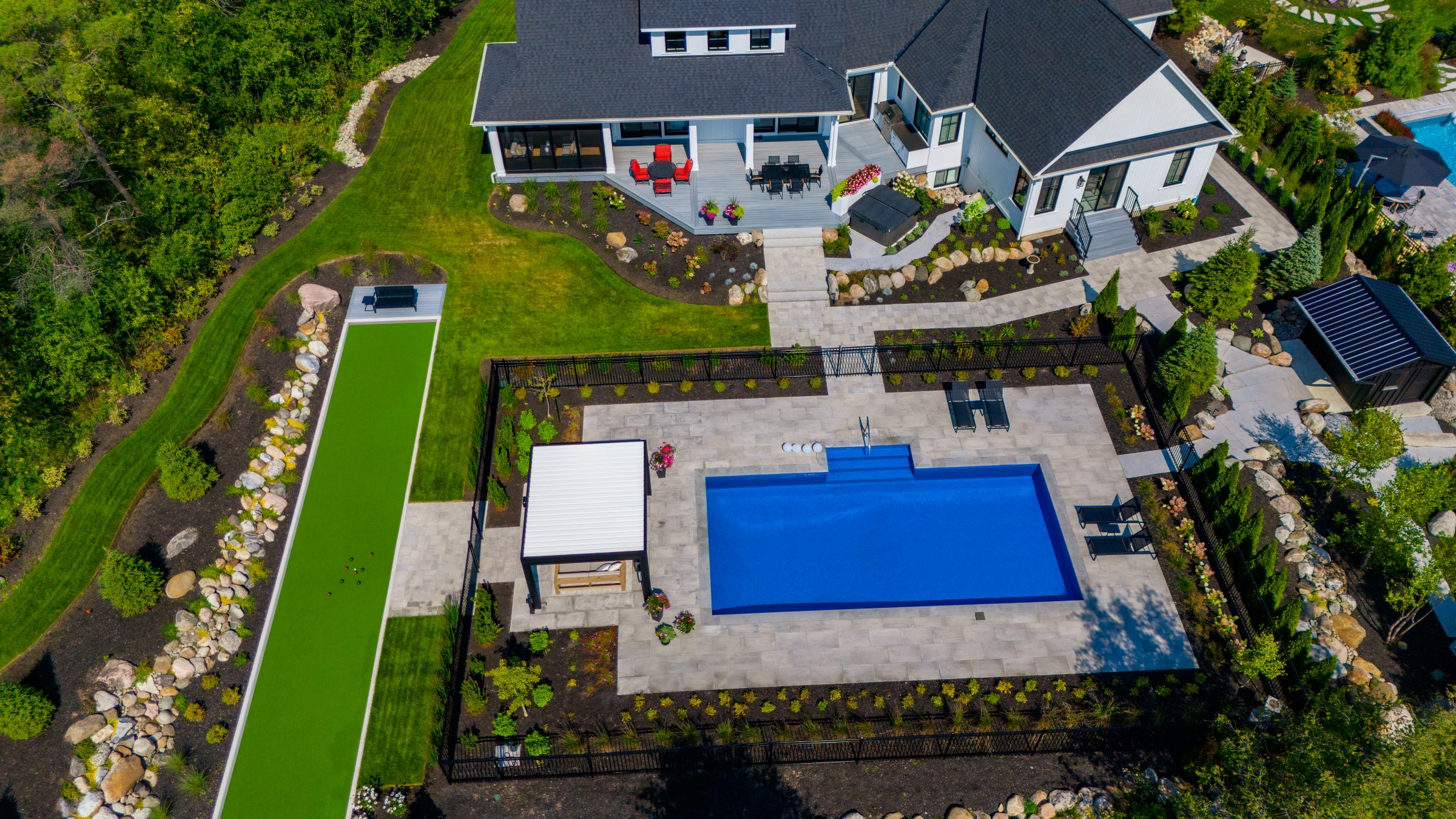 Aerial view of modern home with pool