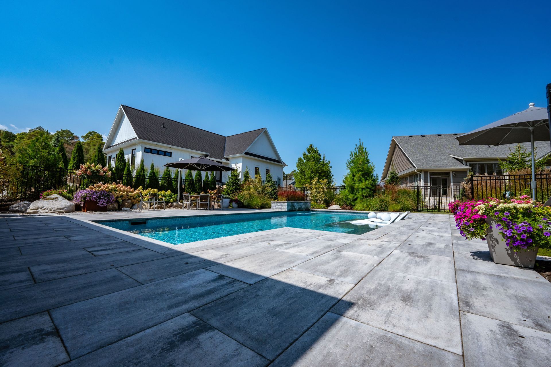 Modern backyard with pool and landscaped patio