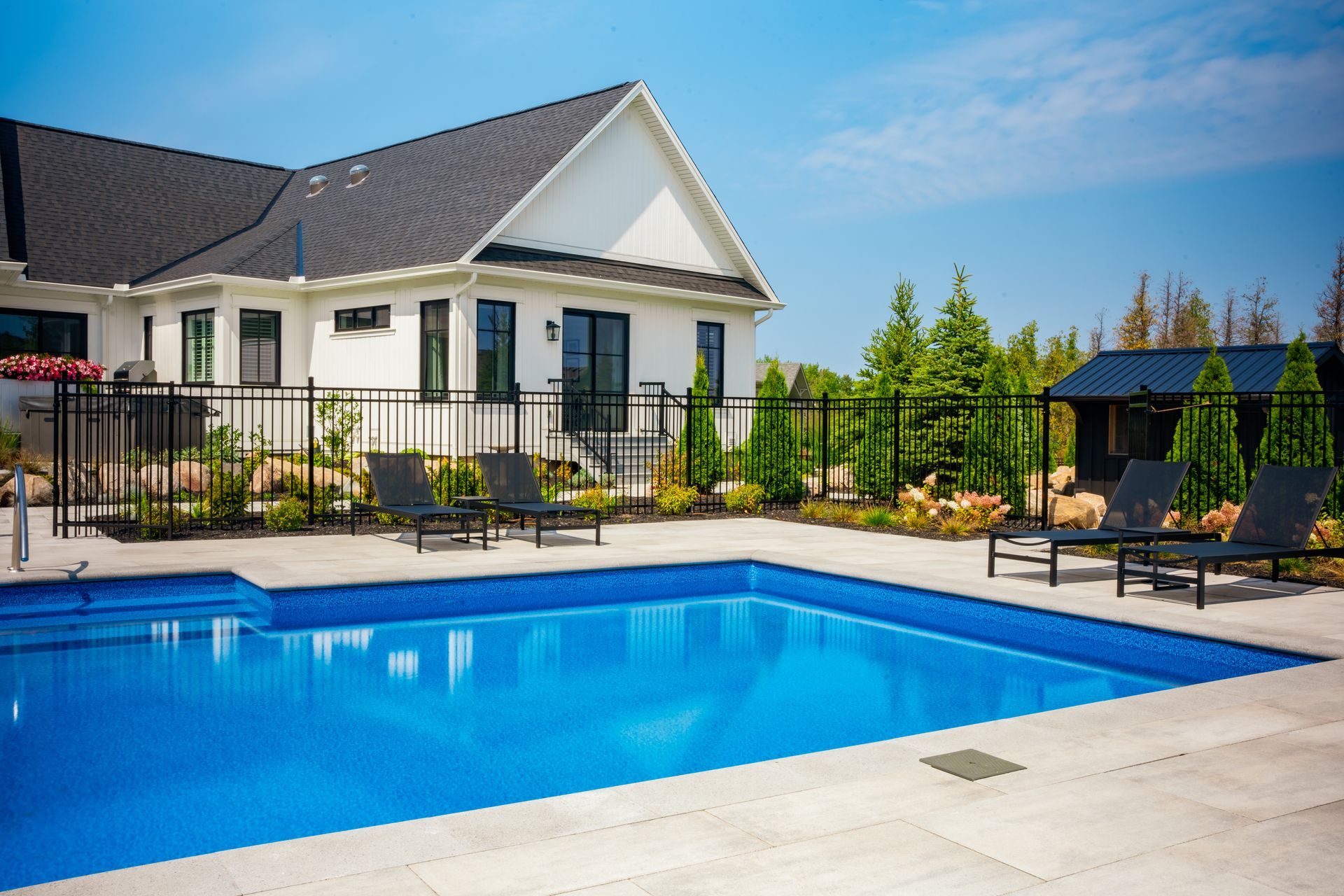 Modern home with backyard swimming pool and patio