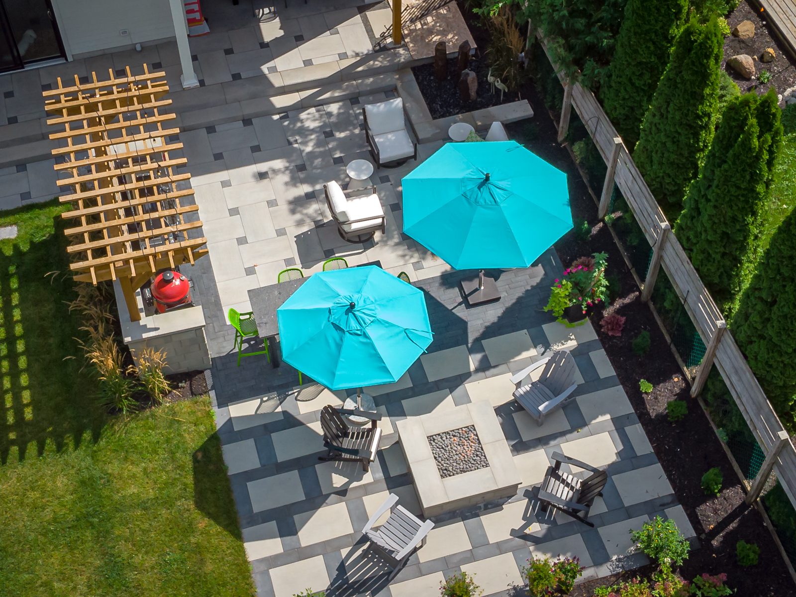 Aerial view of modern backyard patio with umbrellas
