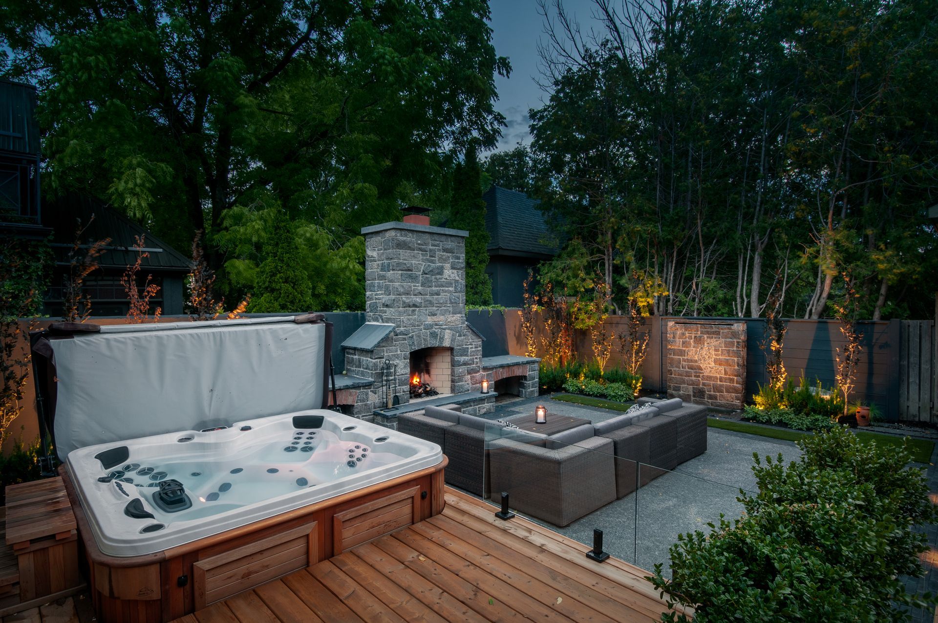 Luxury backyard patio with hot tub and fireplace