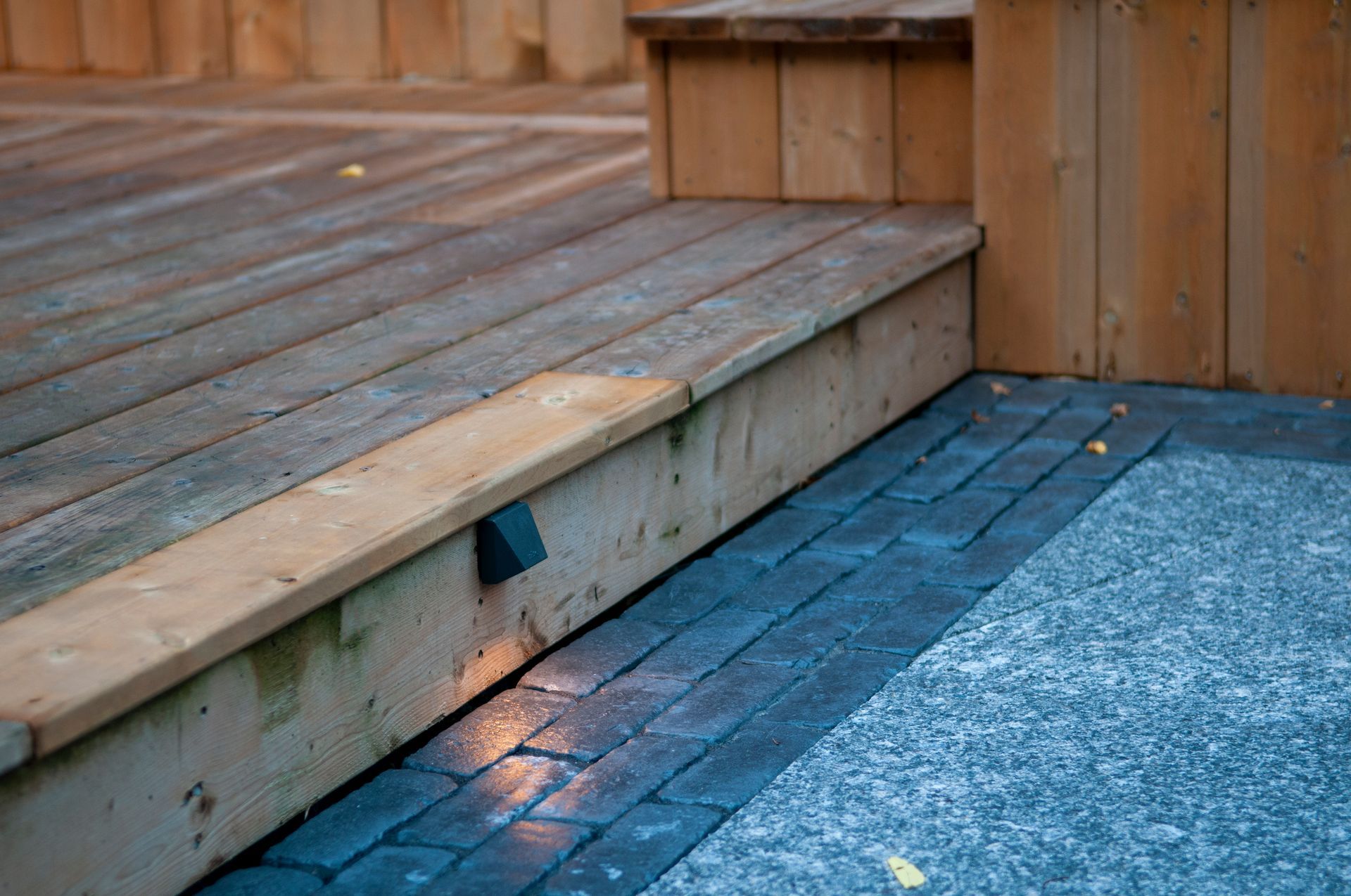 Wooden deck steps with built-in outdoor lighting