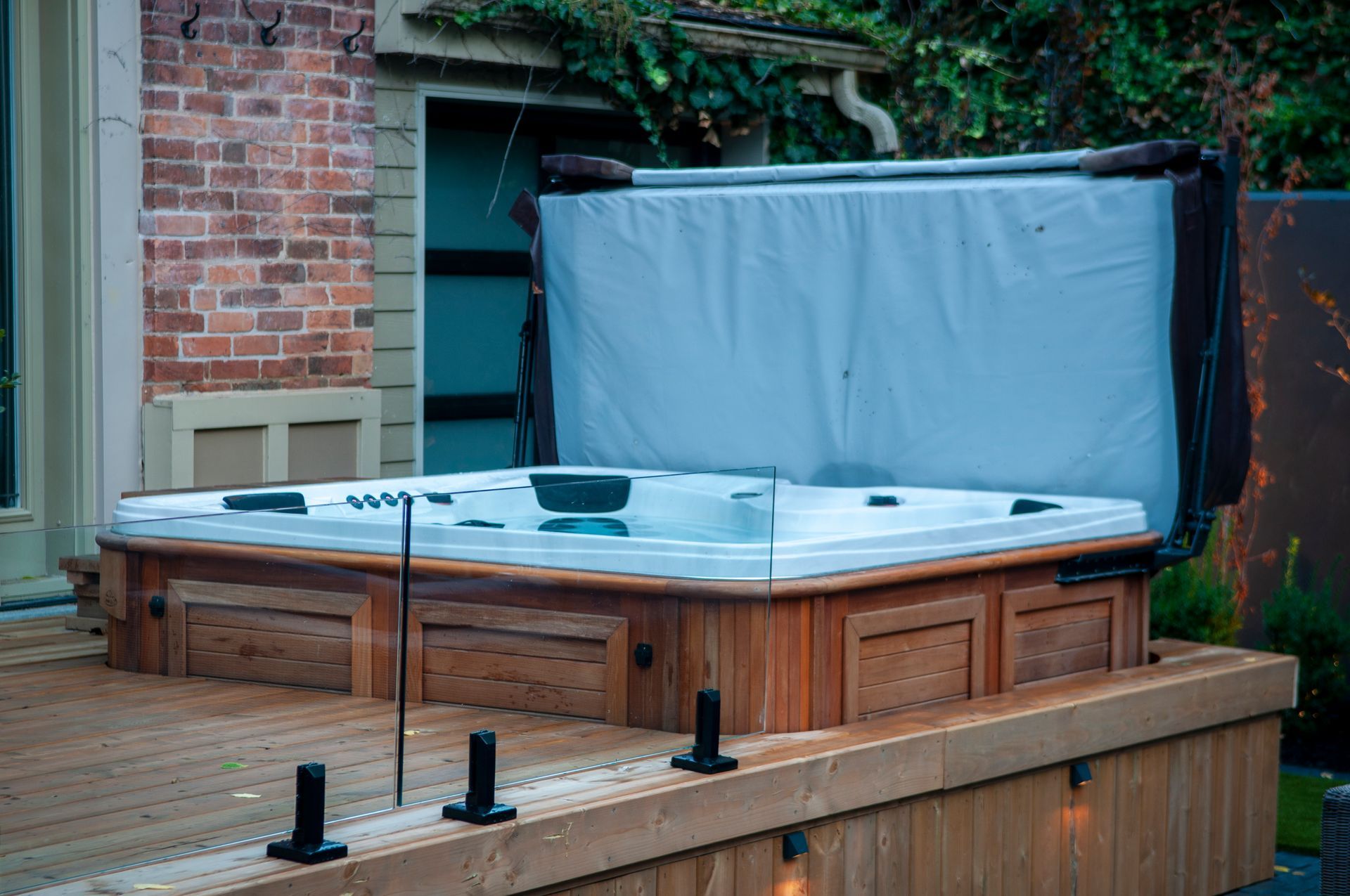 Backyard hot tub on wooden deck