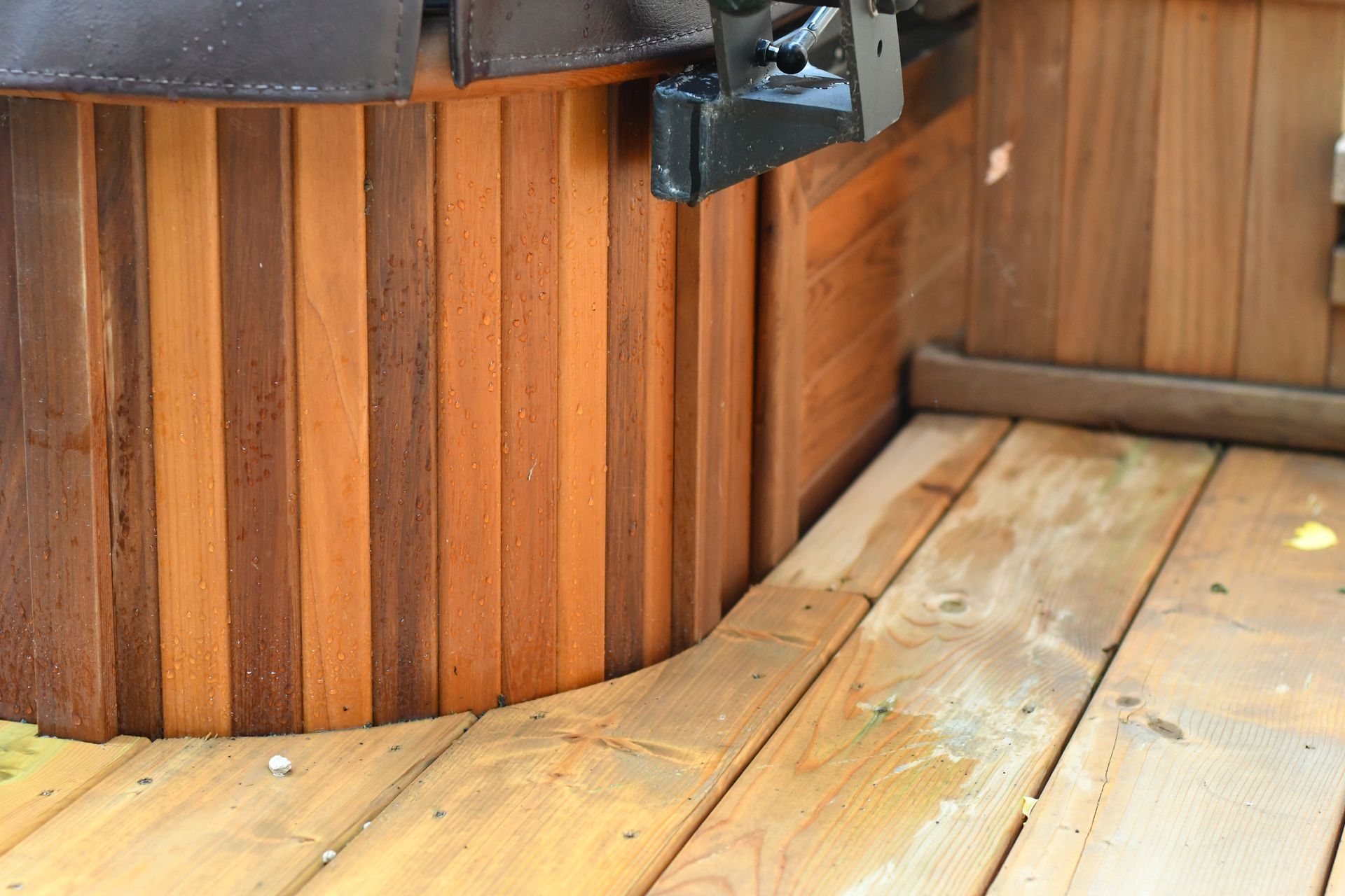 Wooden hot tub exterior with water droplets
