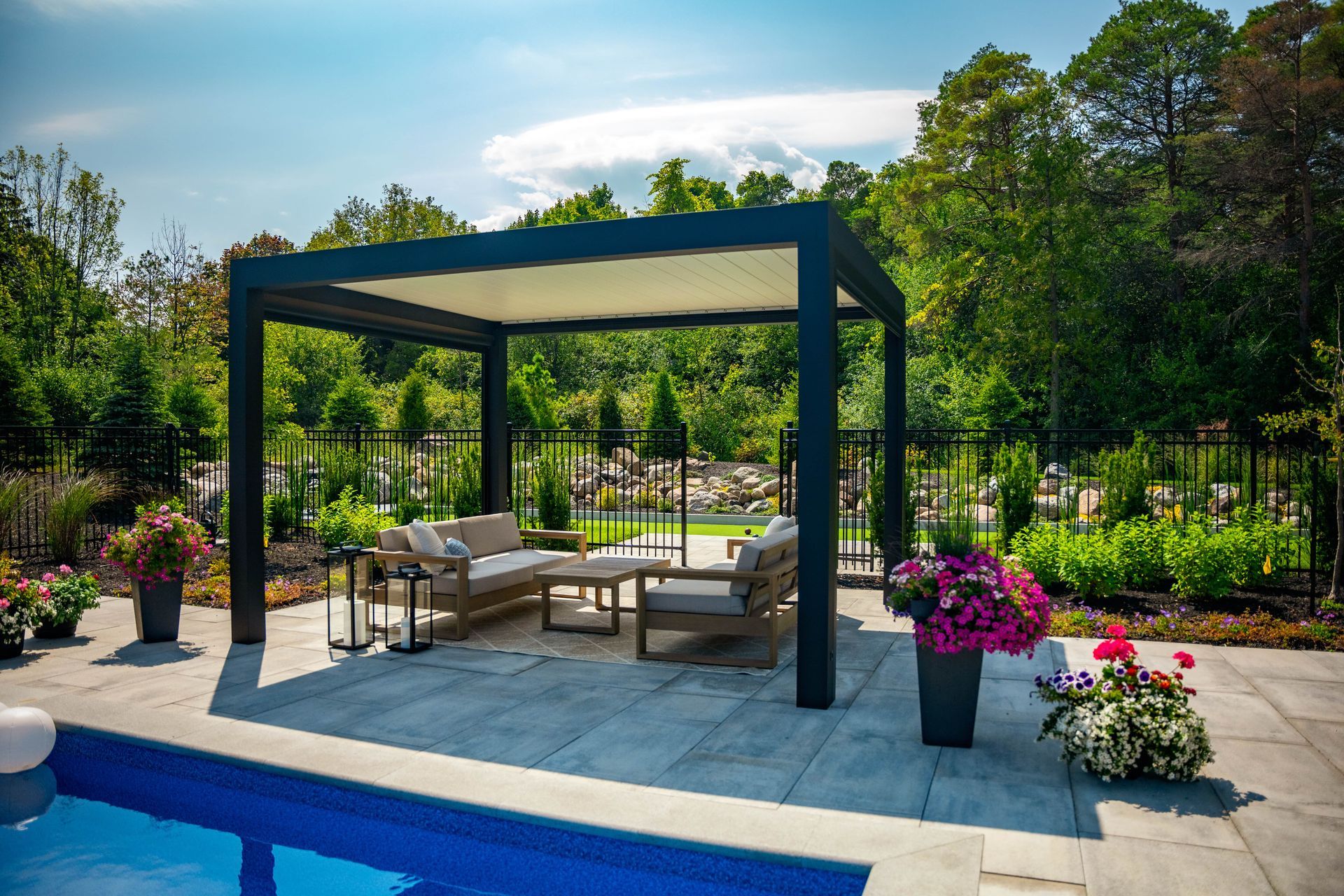 Modern backyard pergola with seating by pool